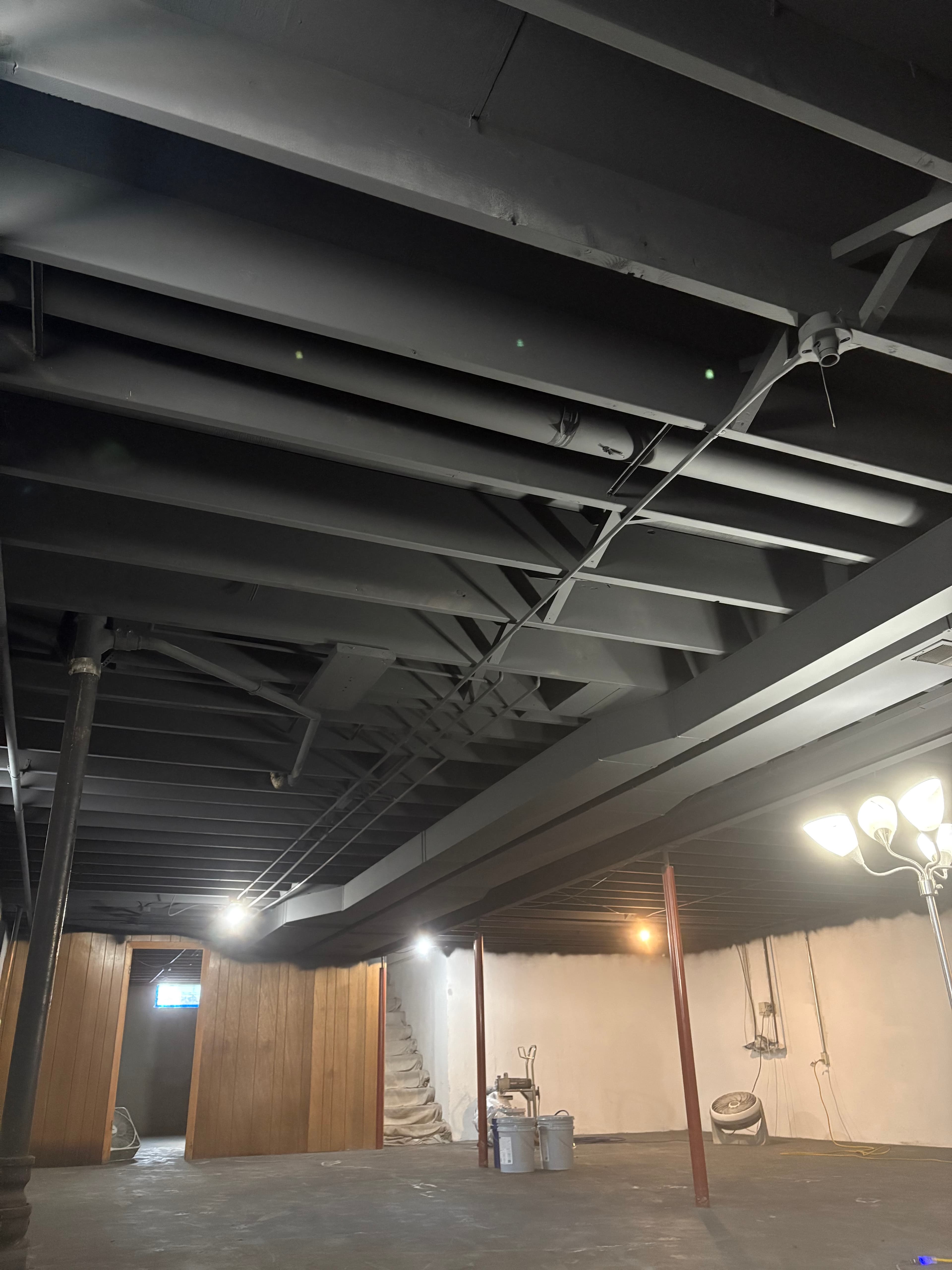 Exposed basement ceiling painted black by Mohr Painting LLC
